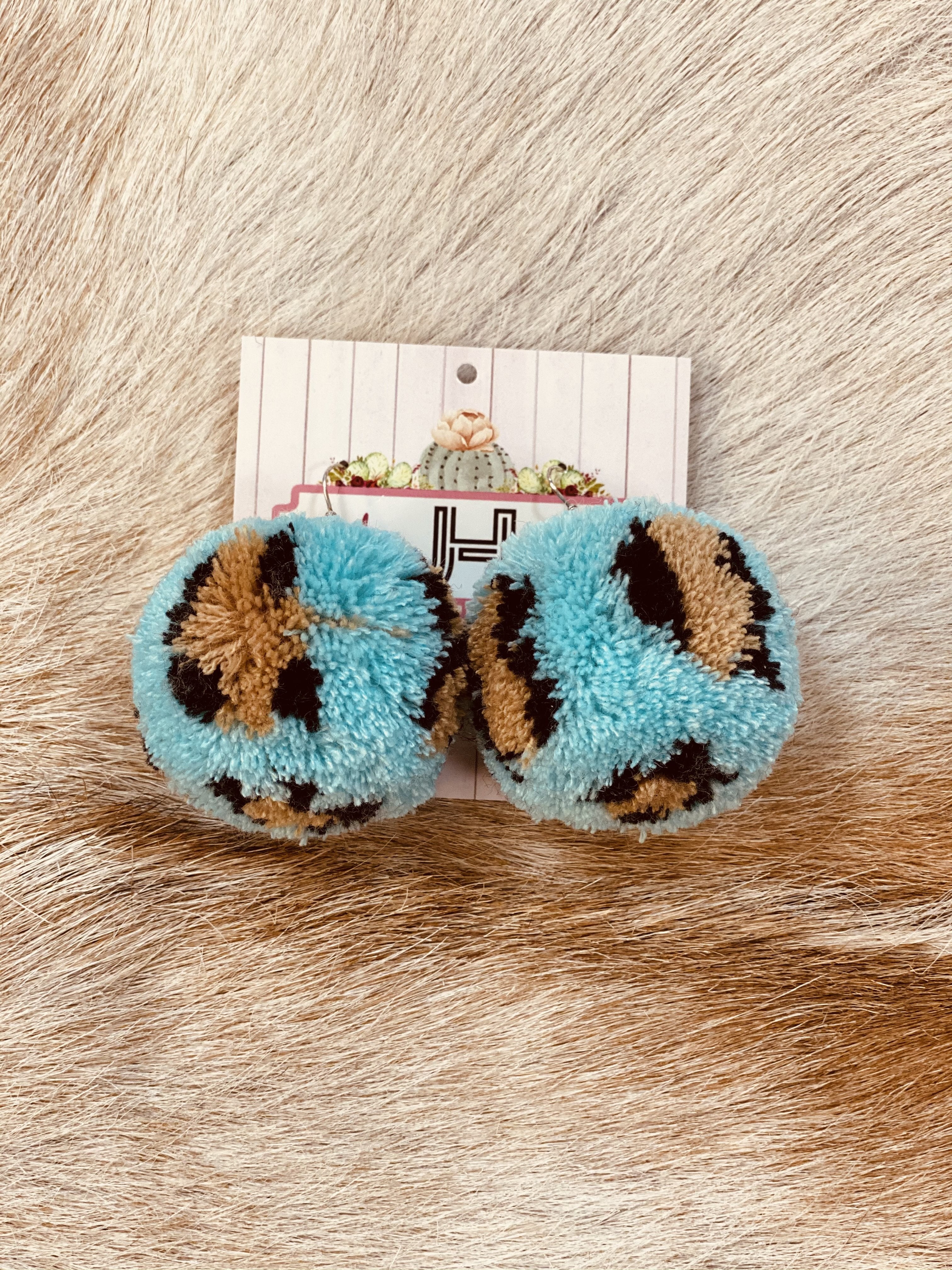 Leopard pom store pom earrings